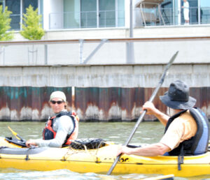 Jake paddles with his father, David.